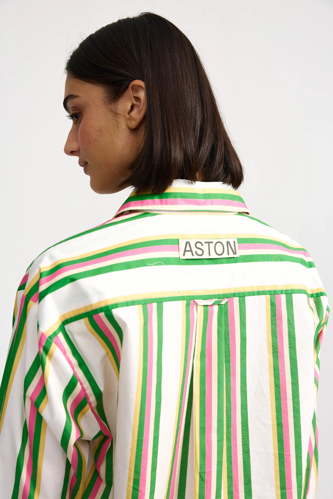 Person wearing a striped shirt with 'ASTON' branding on a white background. Aston Studio Buddy Shirt Meadow Sorbet