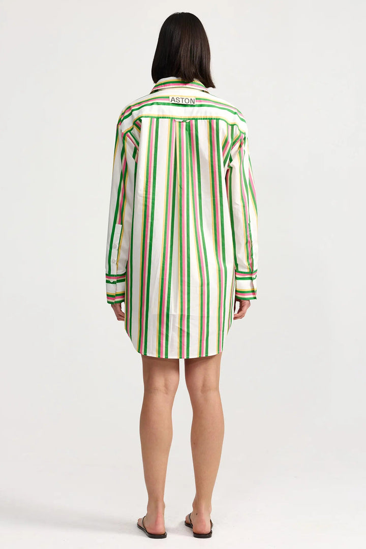 Person wearing a green and white striped shirt dress on a white background. Aston Studio Buddy Shirt Meadow Sorbet