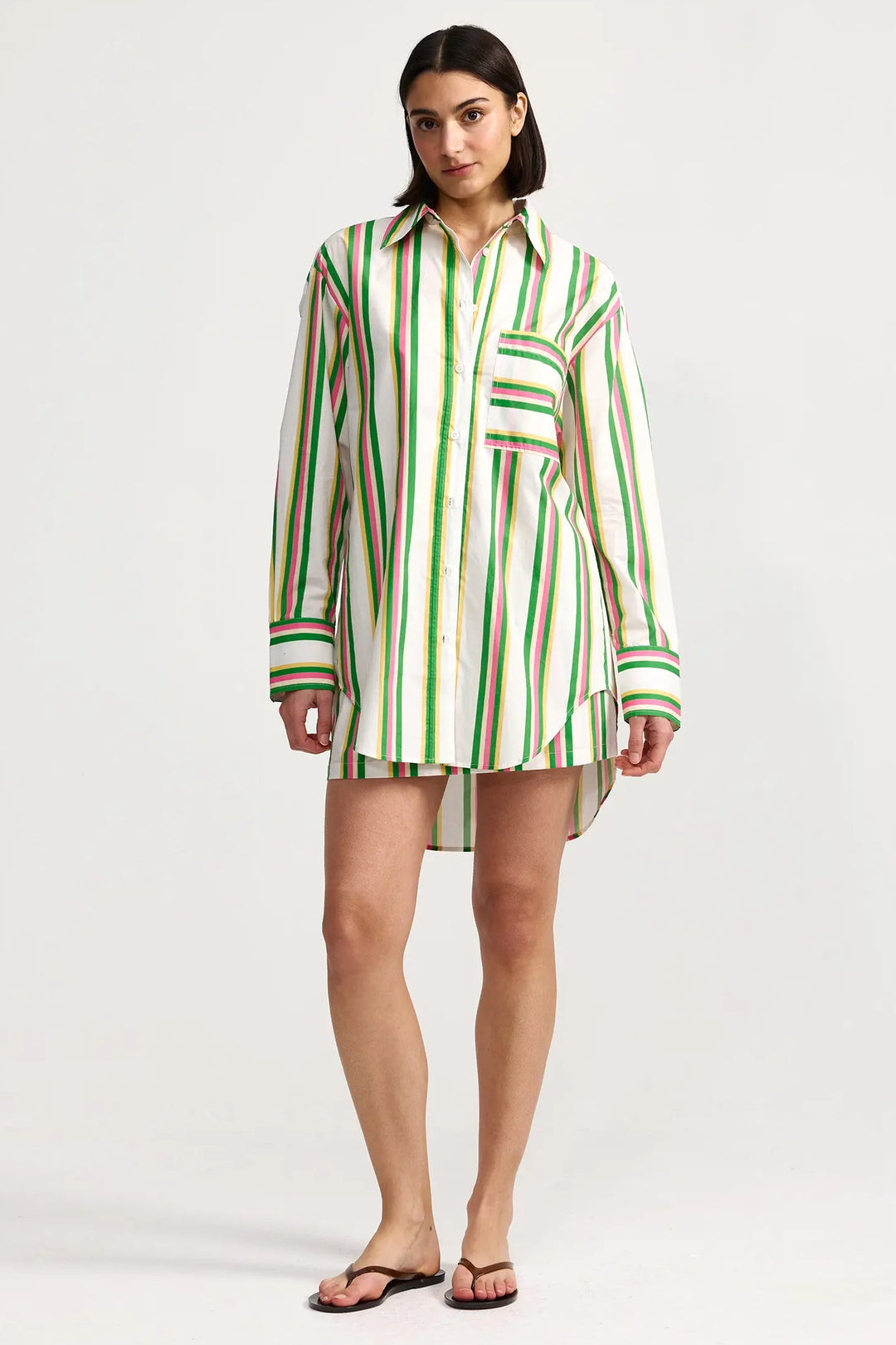 Woman wearing a green and white striped shirt dress on a white background. Aston Studio Buddy Shirt Meadow Sorbet