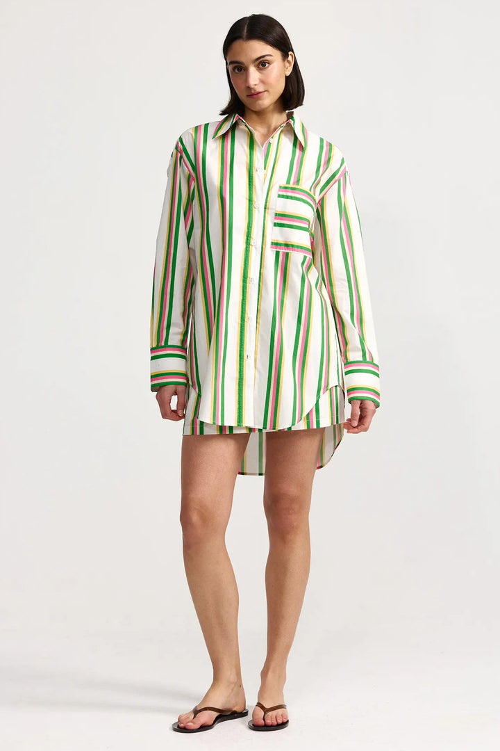 Woman wearing a green and white striped shirt dress on a white background. Aston Studio Buddy Shirt Meadow Sorbet