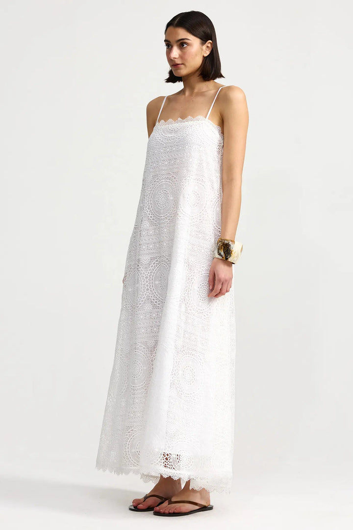 Woman wearing a white dress with thin straps on a white background. Willow Dress Antique