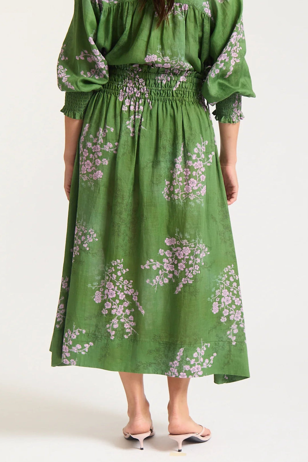Green floral dress on a white background