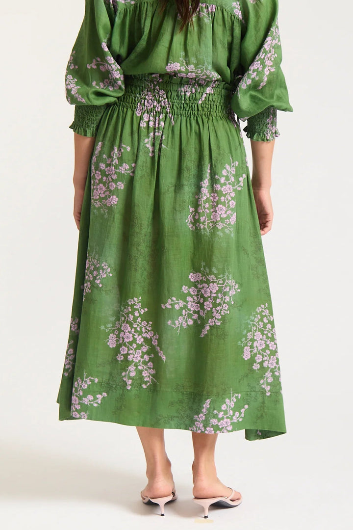 Green floral dress on a white background