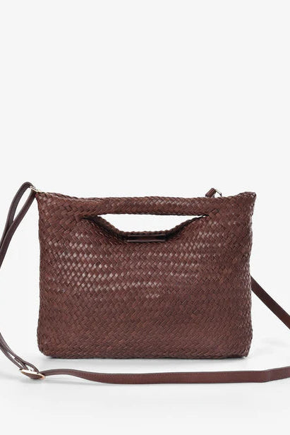 Brown woven handbag with a strap on a white background