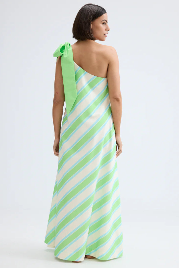 Woman wearing a green and white striped one-shoulder dress on a white background. Aston Studio Mila Dress Fern Lapis Stripe