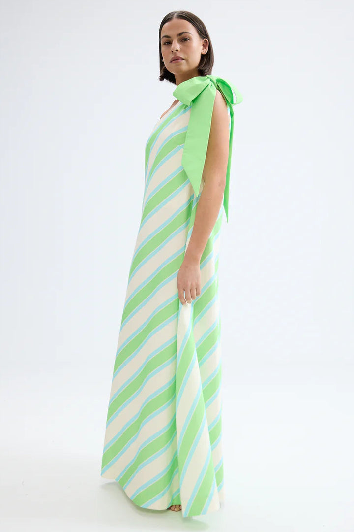 Woman wearing a green and white striped dress on a white background. Aston Studio Mila Dress Fern Lapis Stripe