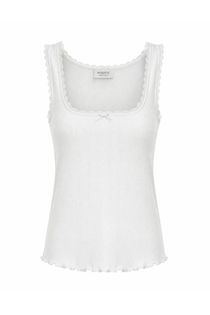 A white ribbed knit tank top with a scoop neckline, scalloped trim along the armholes and hem, and a small bow detail at the center chest, shown against a plain white background.