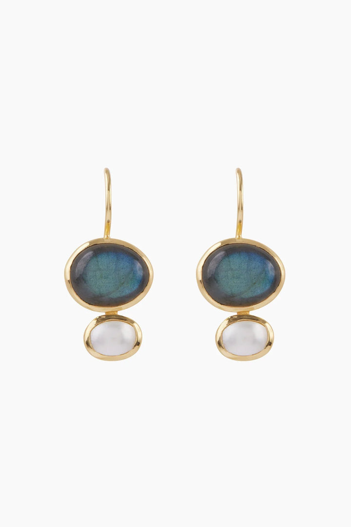 A pair of gold drop earrings featuring oval blue-green iridescent stones on the top and smooth white oval stones on the bottom, set against a plain white background.