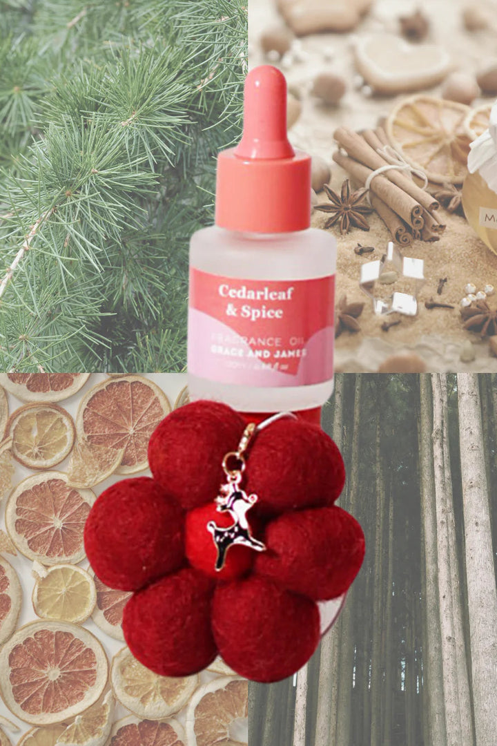 Bottle of 'Cedarleaf & Spice' essential oil with a red flower-shaped felt air freshener on a textured background. Cedarleaf & Spice
