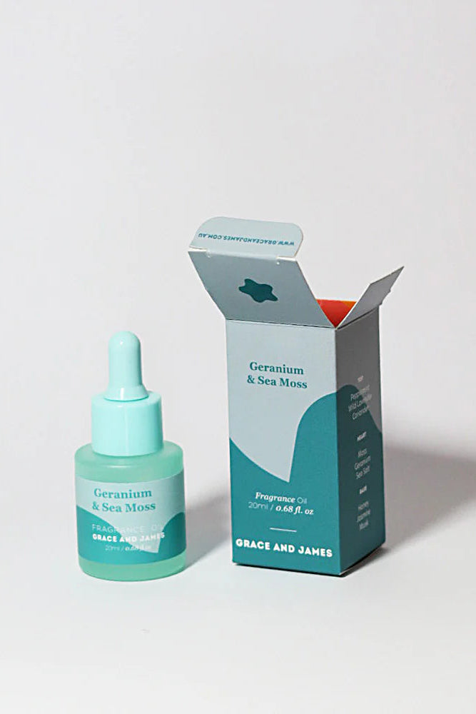 Teal fragranced oil bottle and packaging on a light gray background. Felt Air freshener Geranium and Sea Moss