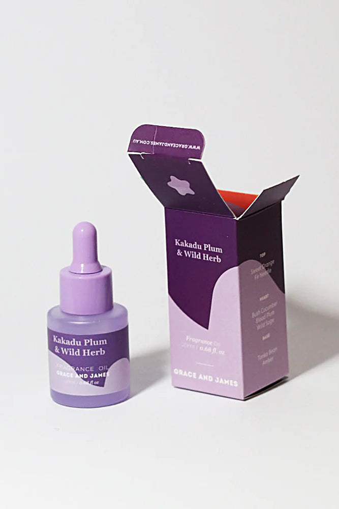 Purple fragranced oil dropper bottle and packaging on a white background
