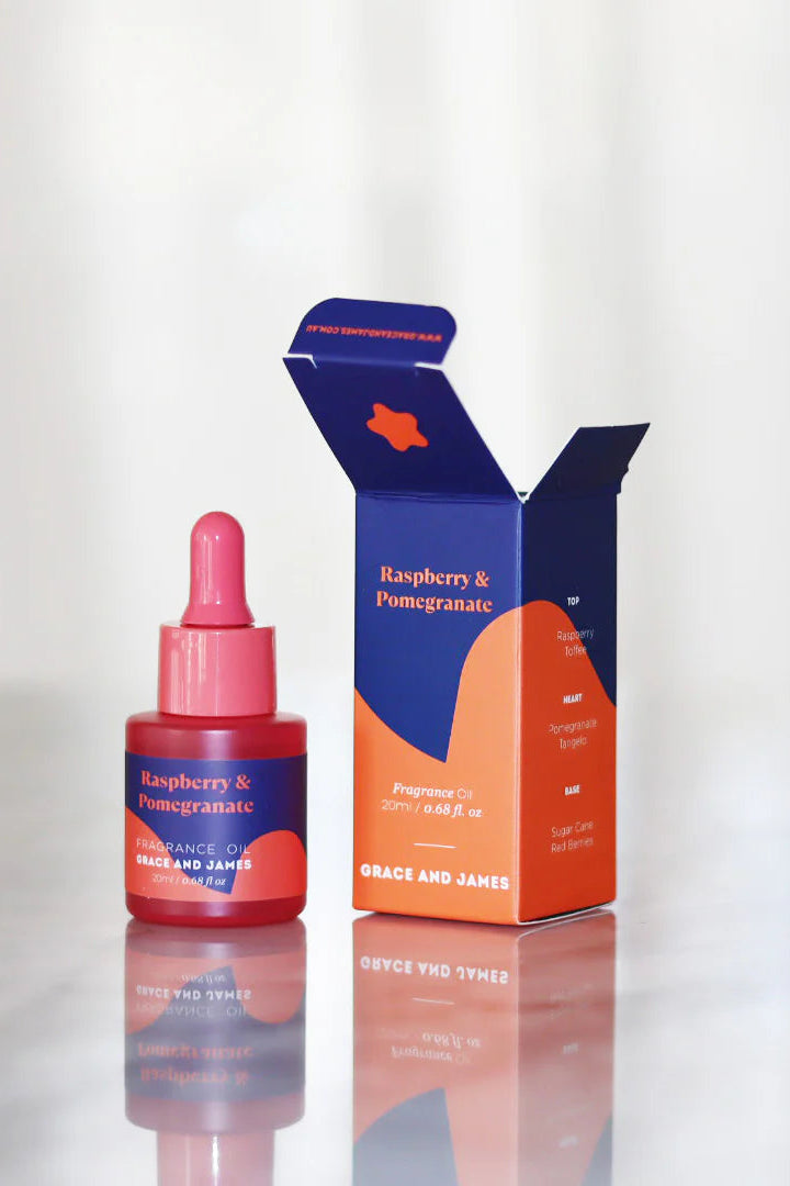 Raspberry & Pomegranate skincare product with packaging on a reflective surface