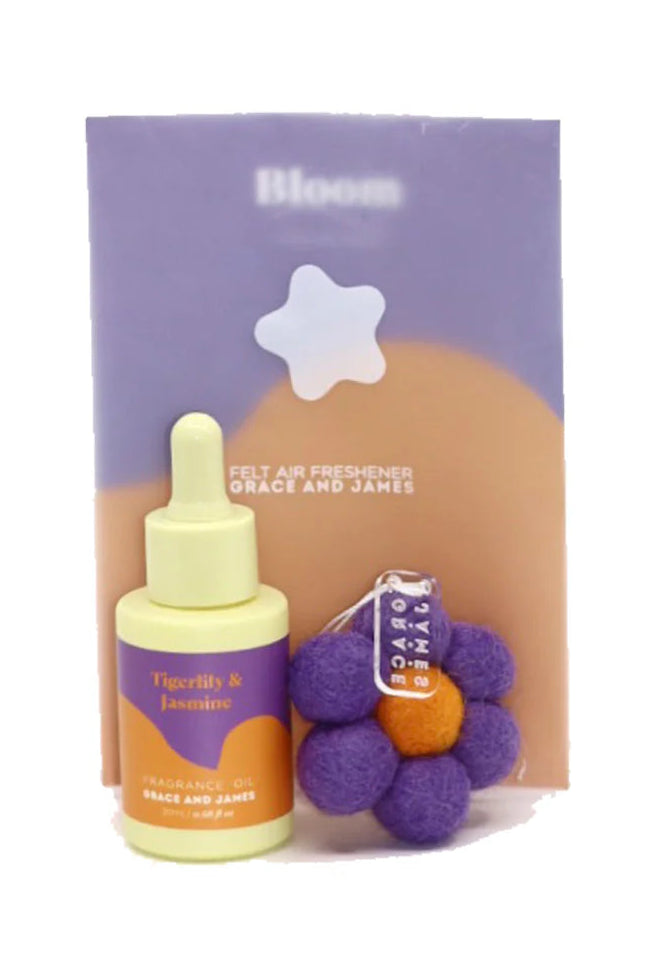 Air freshener bottle with packaging and flower shaped felt air freshener on a white background