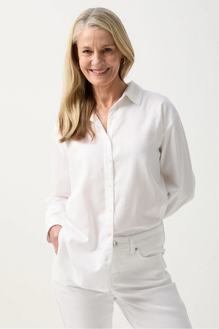 Woman wearing a white shirt and pants on a white background