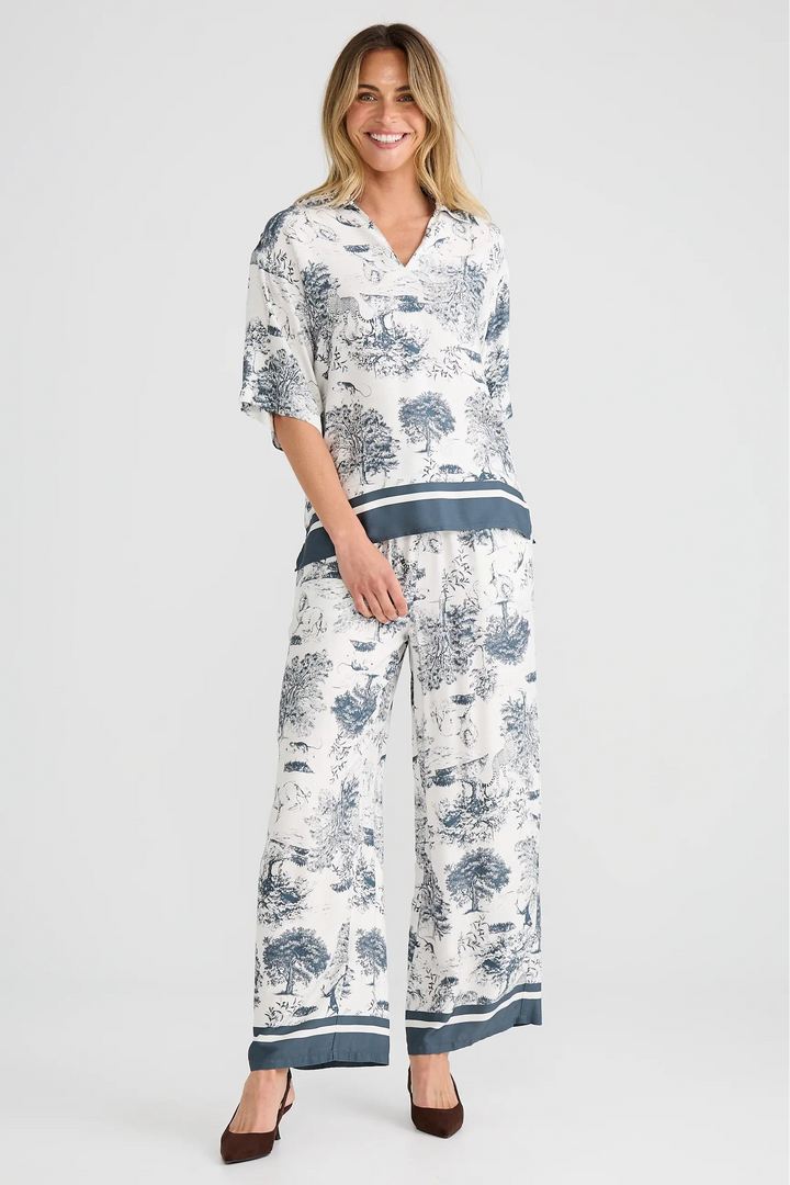 Woman wearing a floral outfit on a white background