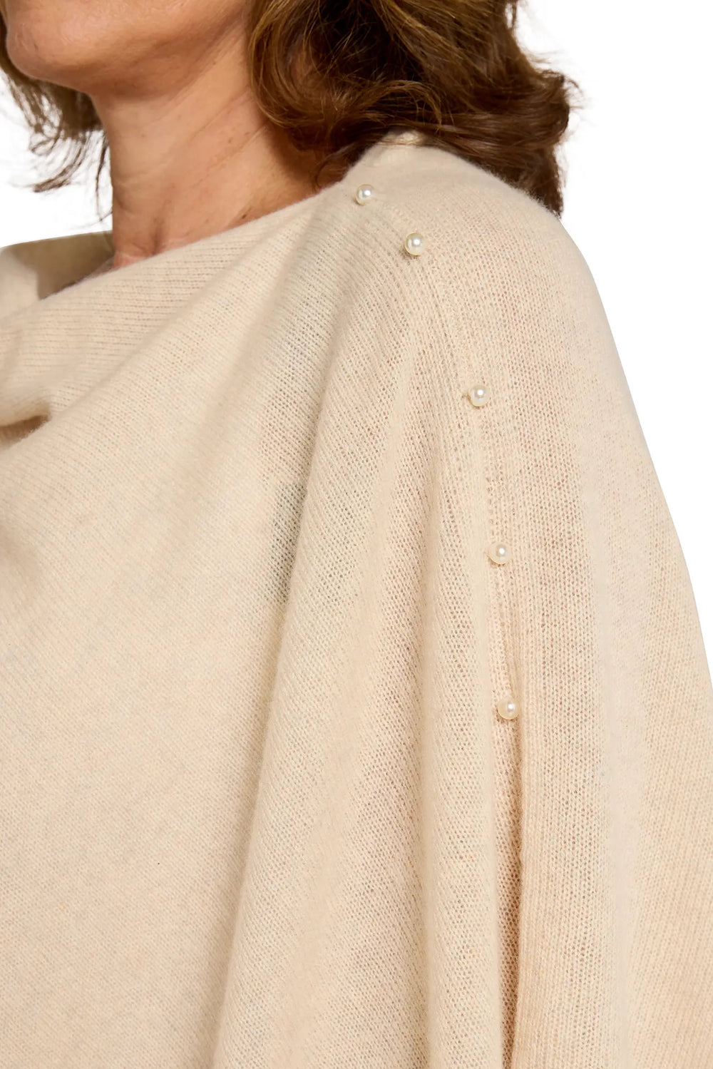 Beige shawl with pearl embellishments on a white background