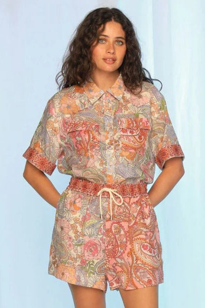 Woman wearing a floral outfit on a white background. Kachel Shyla Shorts