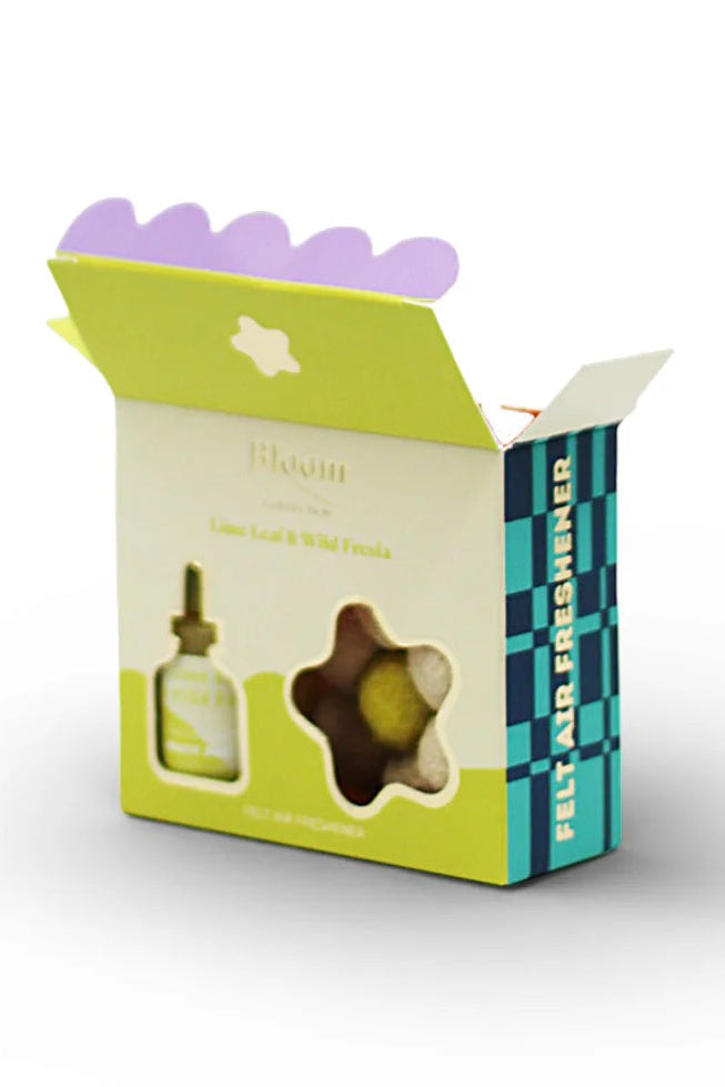 Product packaging with a dropper and star-shaped item on a white background