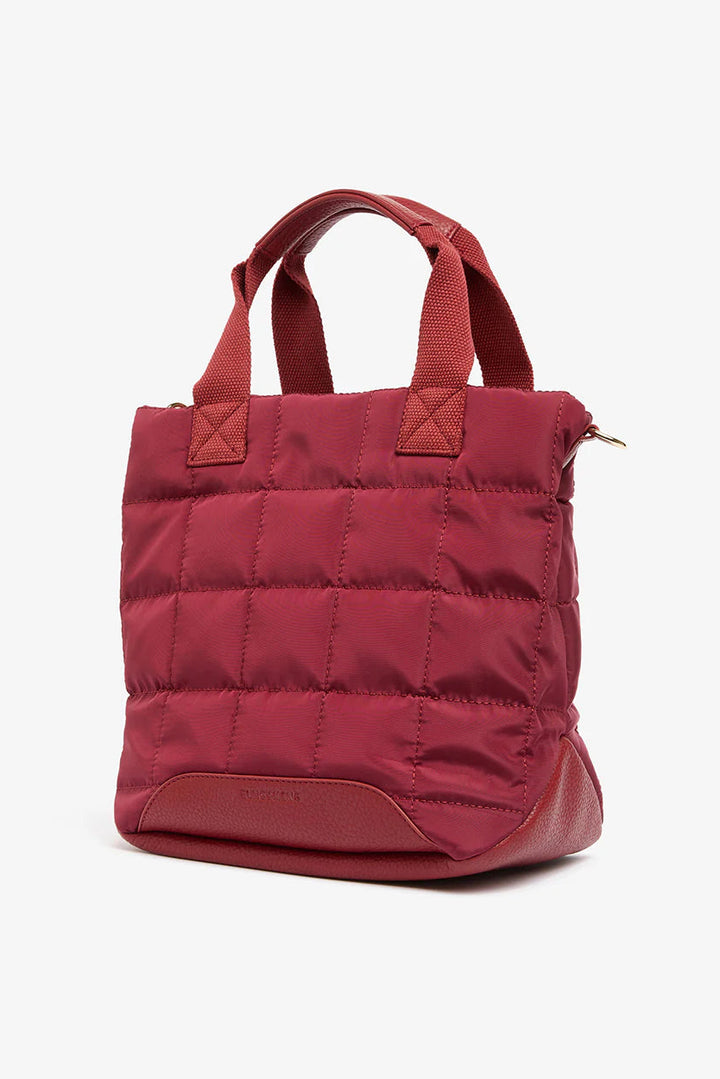 Burgundy puffer bag on a white background