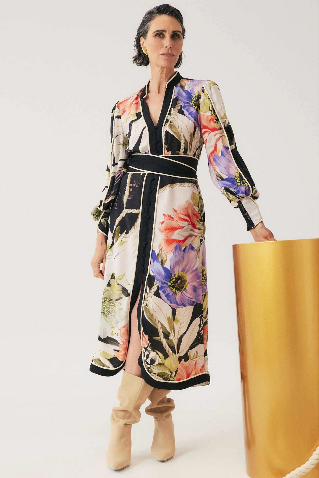 Woman wearing a floral dress with a white background