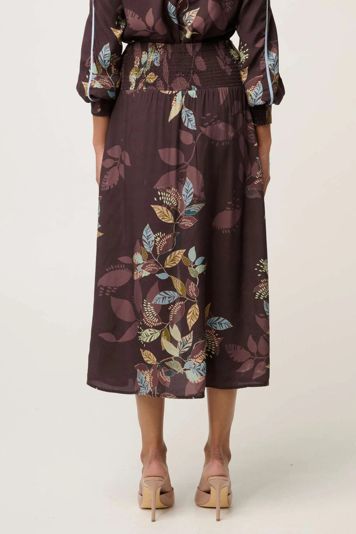 Long floral dress with a belt on a white background