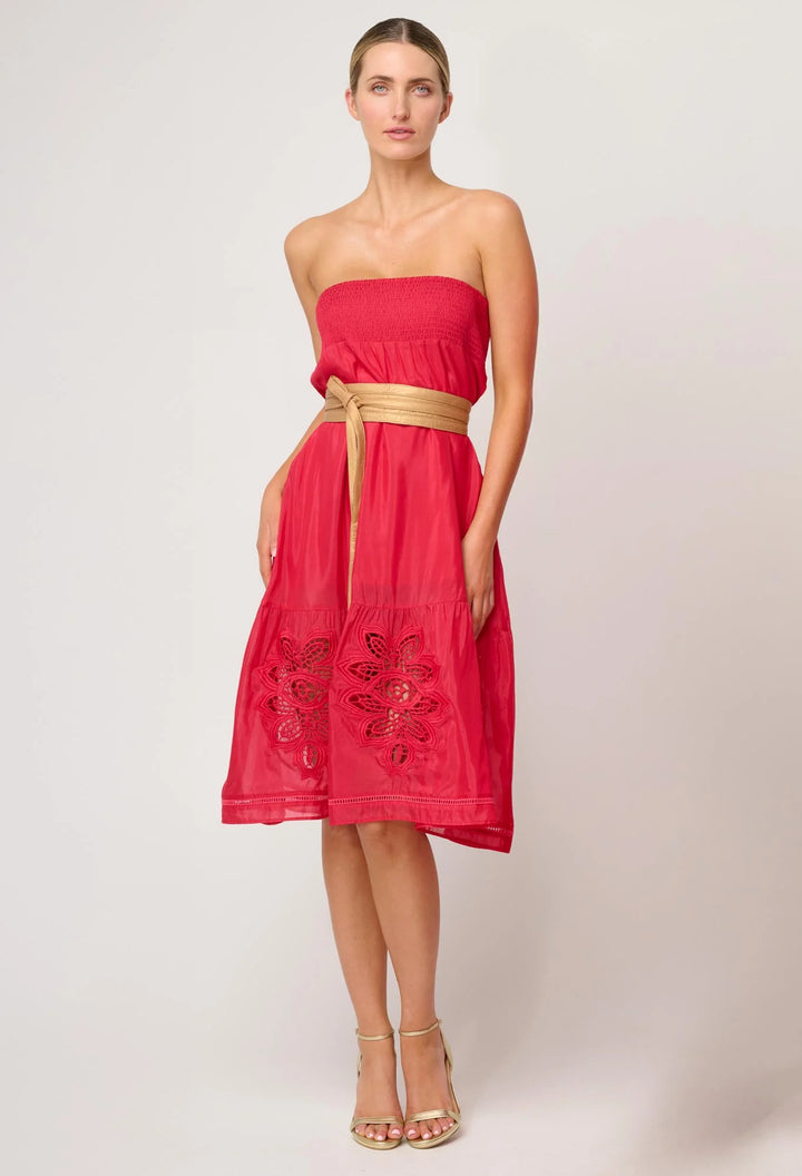 Woman wearing a red strapless dress with gold belt on a white background. Once Was Milton Belt Gold.