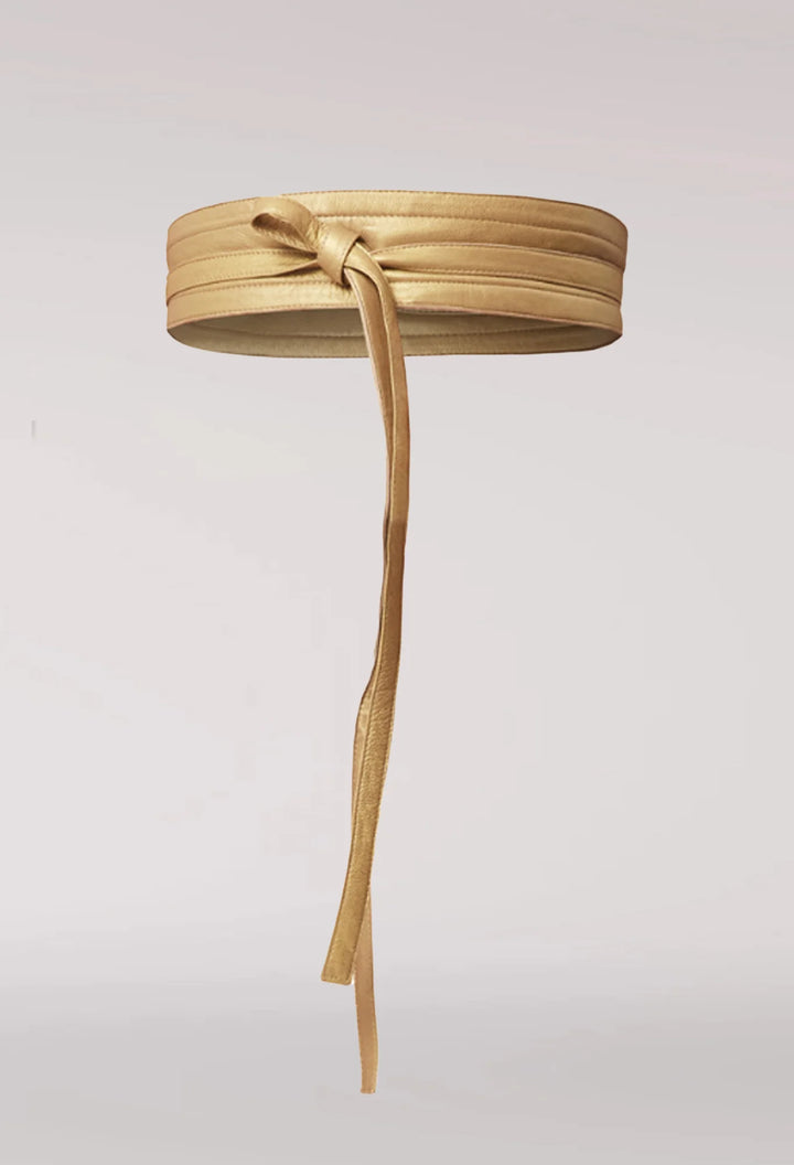 Gold belt with a bow on a light gray background. Once Was Milton Belt Gold.