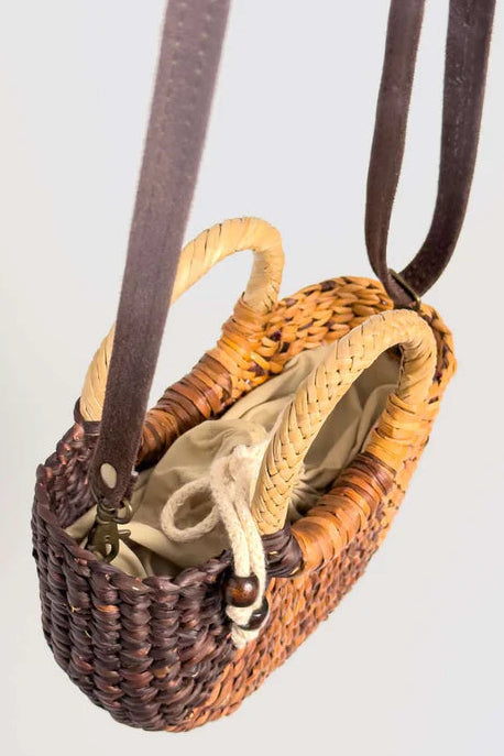 Woven handbag with leather straps on a light gray background. Orange Inca Fiesta Mini Classic Browns