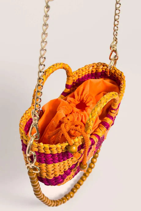 Colorful woven handbag with a chain strap on a light gray background. Orange Inca The New Mini Fiesta Fuschia Yellow Stripe
