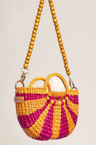 Woven handbag with yellow and pink striped pattern on a beige background. Orange Inca The New Mini Fiesta Fuschia Yellow Stripe