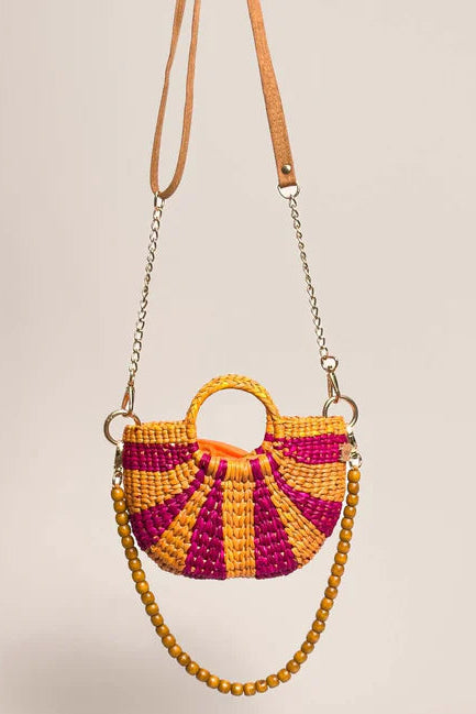 Handmade bag with pink and orange pattern on a beige background. Orange Inca The New Mini Fiesta Fuschia Yellow Stripe