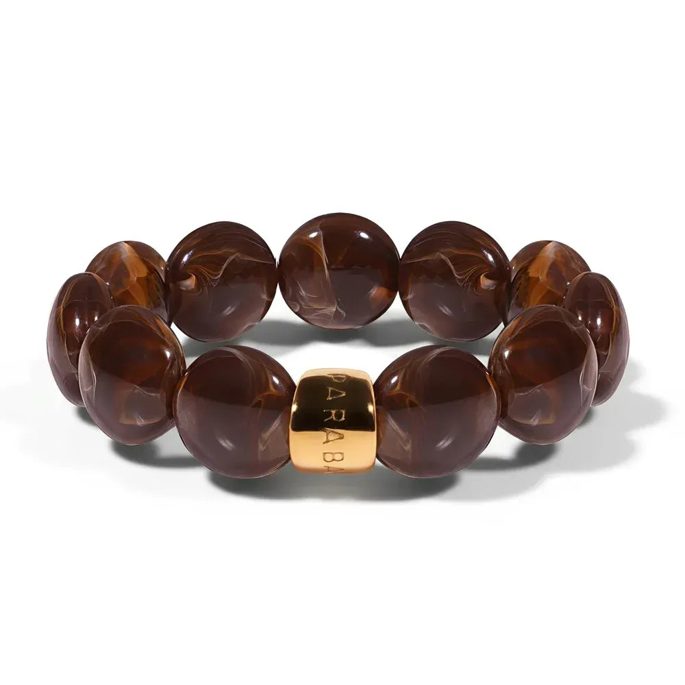 Brown marbled beaded bracelet with a gold accent on a white background