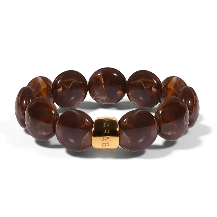 Brown marbled beaded bracelet with a gold accent on a white background