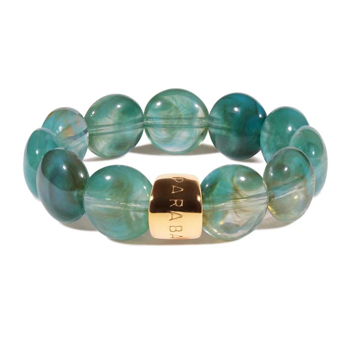 Green beaded bracelet with a gold clasp on a white background