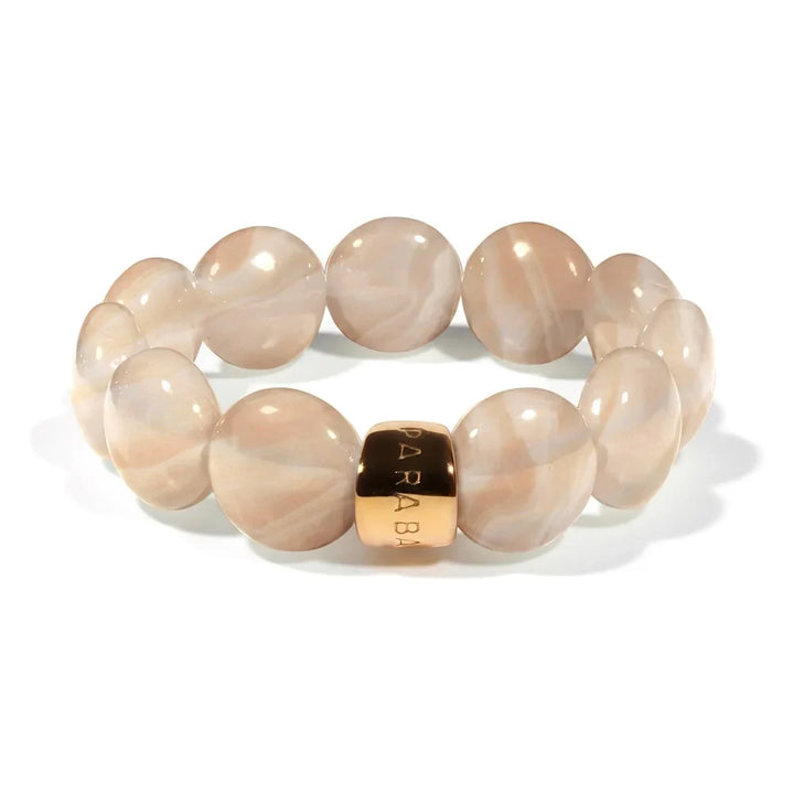 Beaded bracelet with a gold accent on a white background