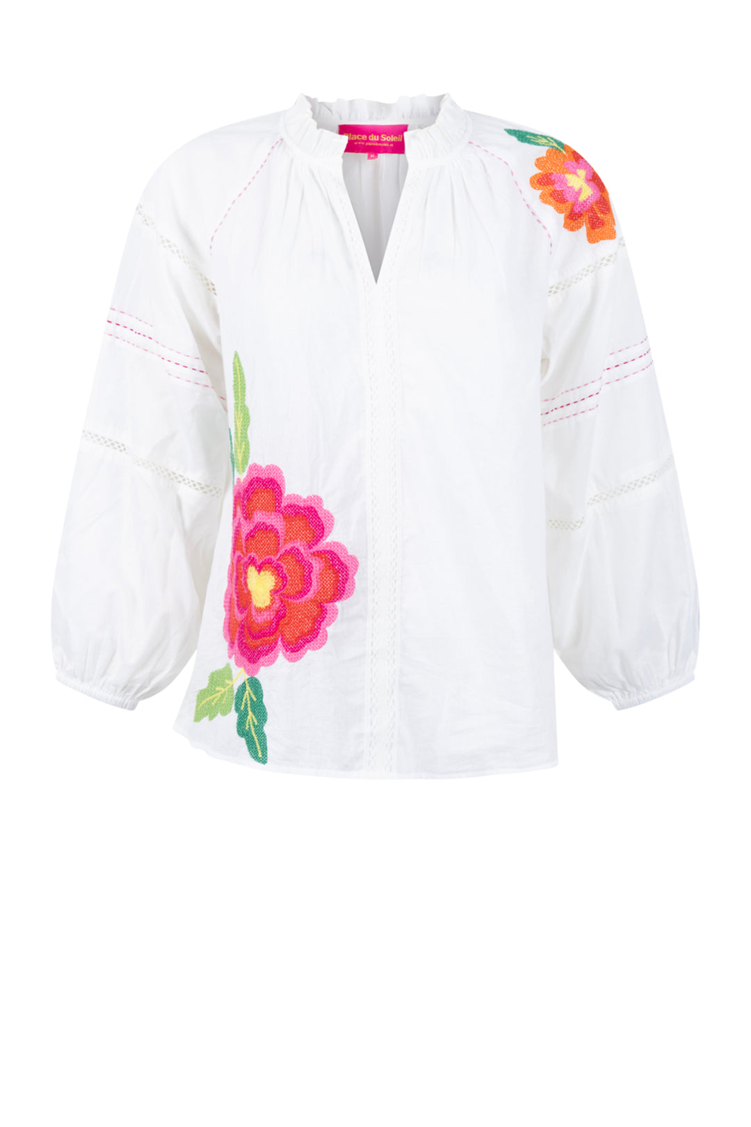 White blouse with colorful floral embroidery on a white background