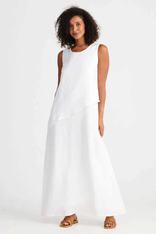 Woman wearing Shanty Corporation white sleeveless Grace dress on a white background