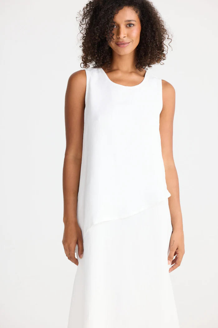 Woman wearing Shanty Corporation white sleeveless Grace dress on a white background