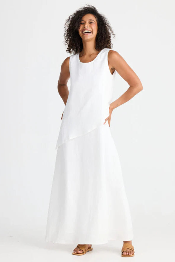 Woman wearing Shanty Corporation white sleeveless Grace dress on a white background