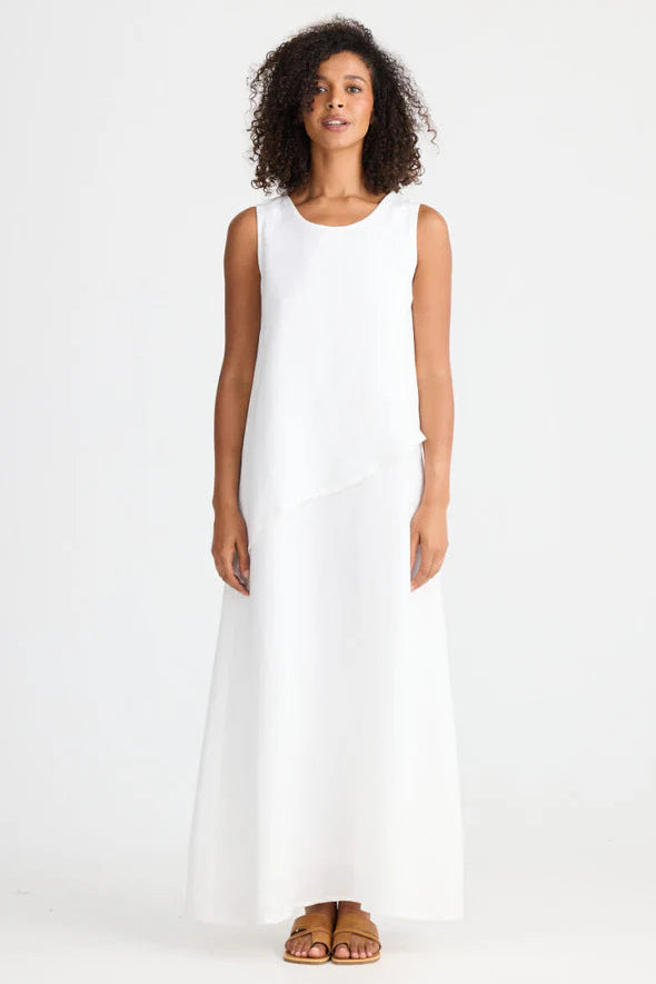Woman wearing Shanty Corporation white sleeveless Grace dress on a white background