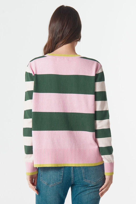 Person wearing a striped sweater and jeans on a white background