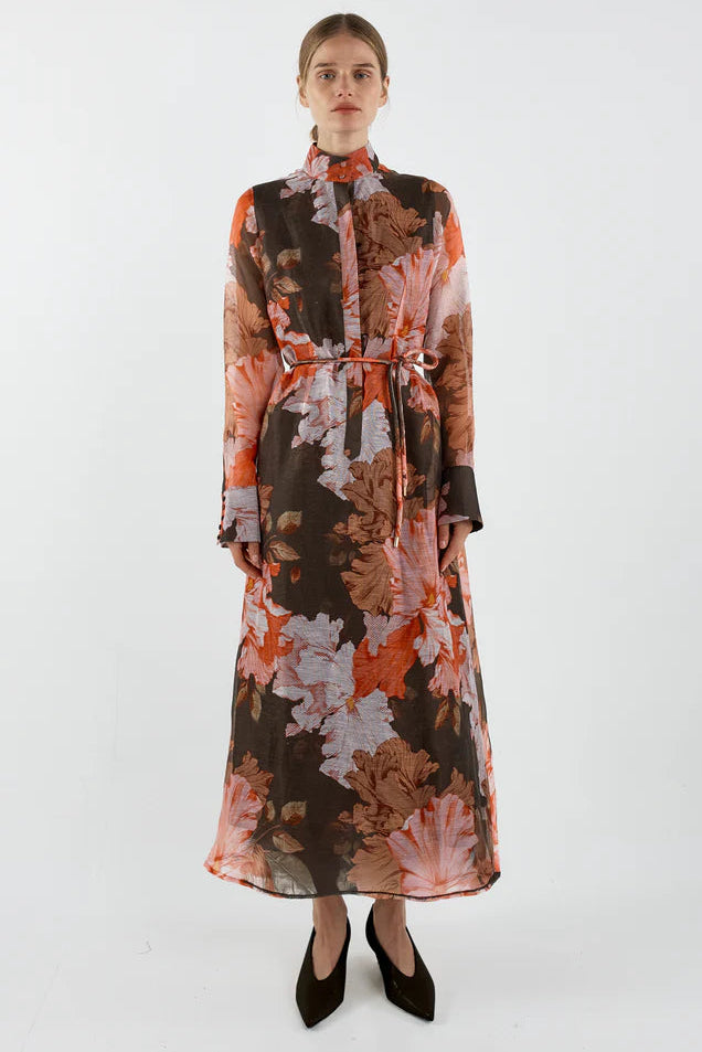 Woman wearing a floral dress on a white background