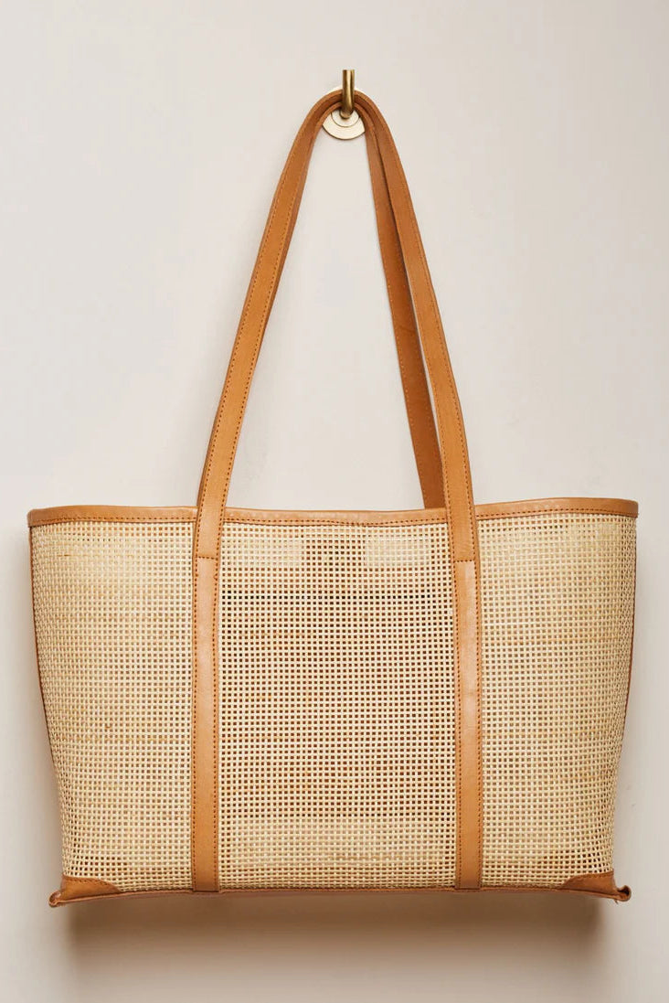 Woven tote bag with brown leather straps on a light beige background - State of Embrace Carry All Tote Tan
