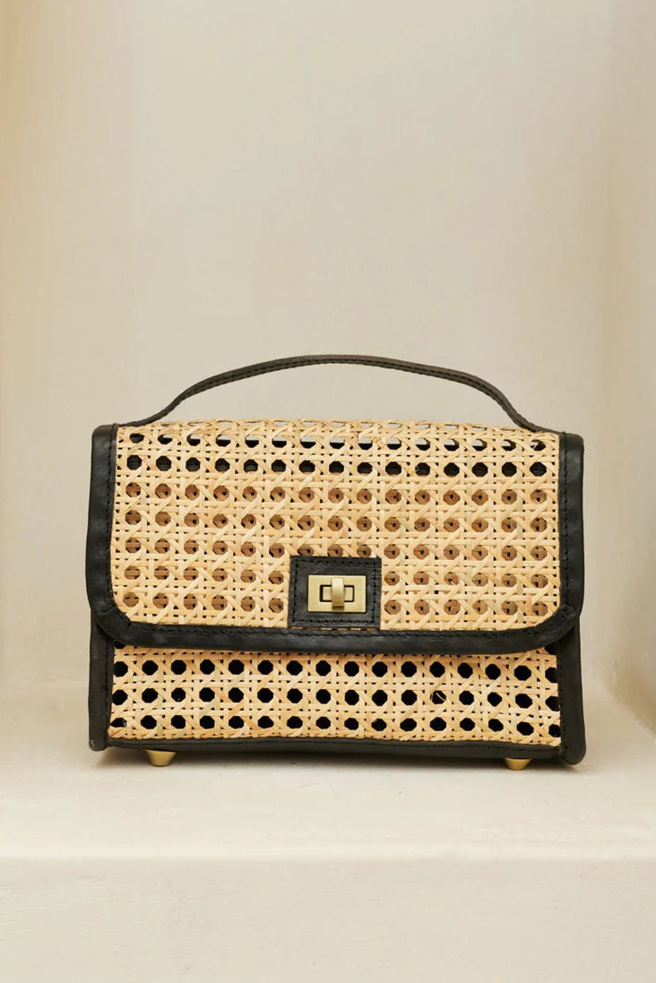 Handbag with wicker design and black leather accents on a beige background - State of Embrace Le Clutch Bag Onyx