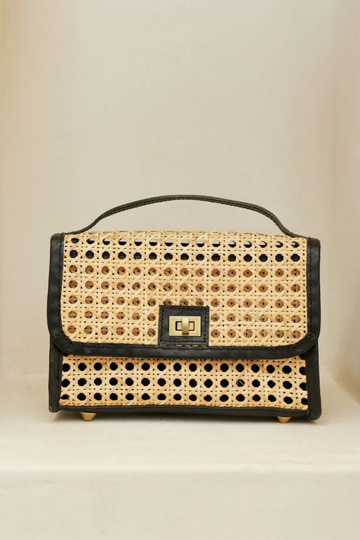 Handbag with wicker design and black leather accents on a beige background - State of Embrace Le Clutch Bag Onyx