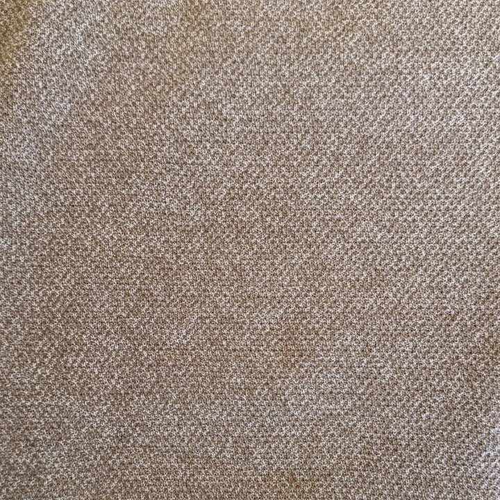 A close-up of a woven fabric texture in a warm taupe-brown color with subtle beige variation.