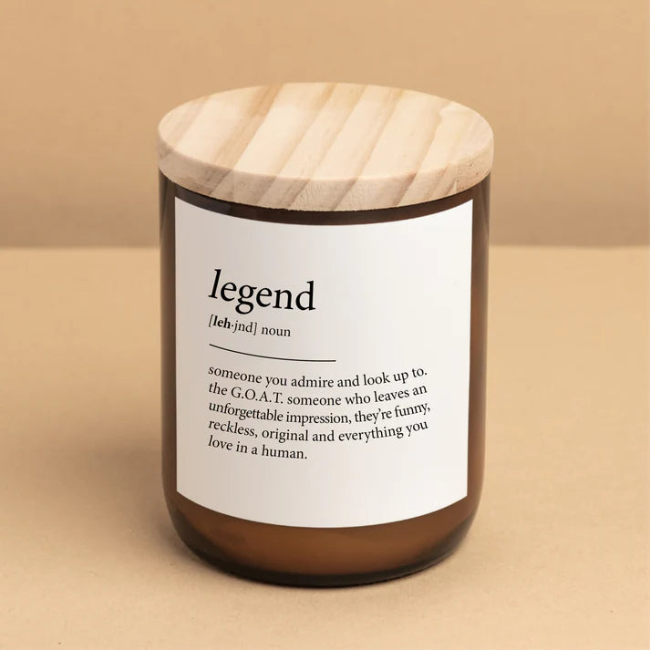 Candle with a wooden lid and label on a beige background