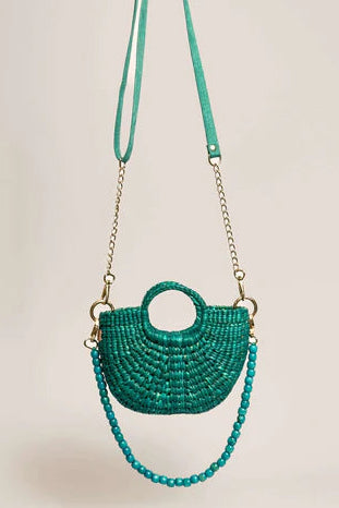 Green beaded handbag with a chain strap on a beige background. The New Mini Fiesta Turquoise
