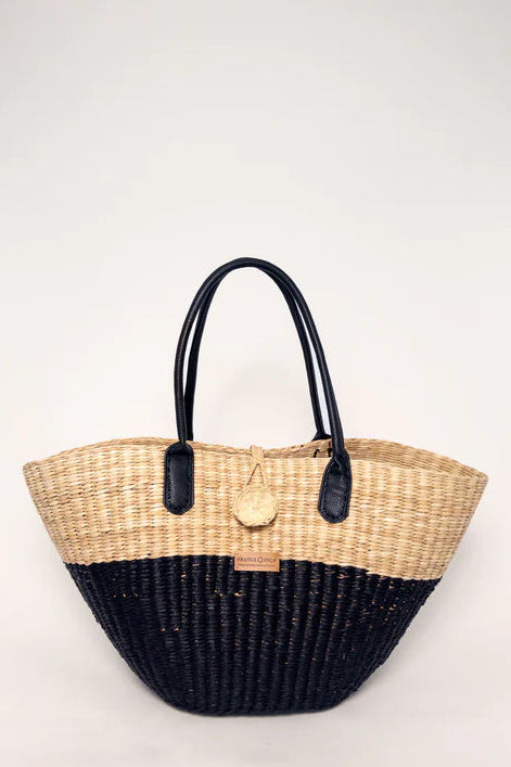 Woven handbag with black base and handle on a white background