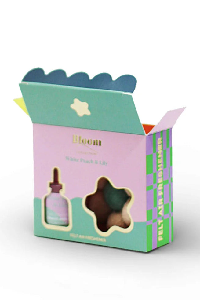 Product packaging with a bottle and star-shaped object on a white background